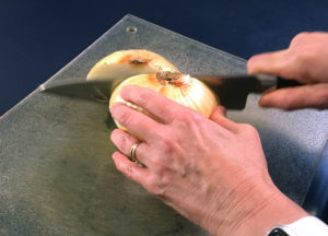 cutting onion through root end