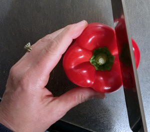 Slice each lobe of pepper away from the core