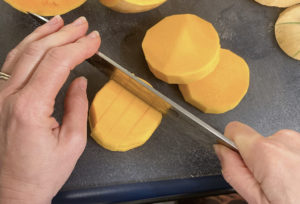 Cutting butternut squash into cubes