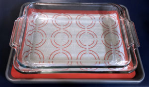 Baker's half sheets with silicone liners and 9x13 baking dish