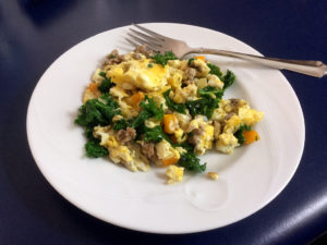 Add meat and veggies to scrambled eggs for a yummy wholesome breakfast!