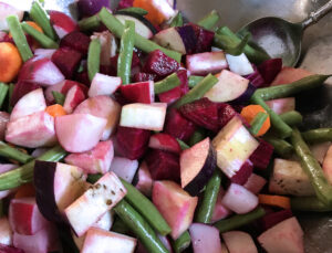 Cut all veggies into cubes for roasting