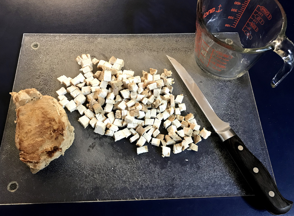 Chopping leftover pork for "Chicken" salad....Use it all up!