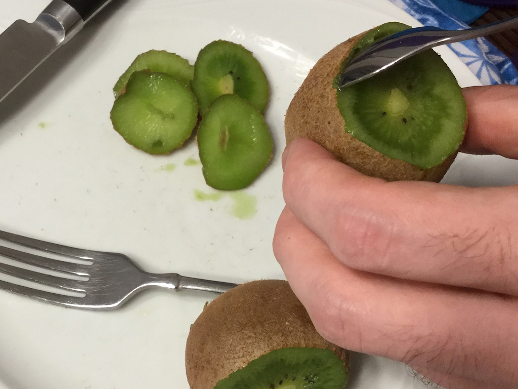 use grapefruit spoon to skin kiwi