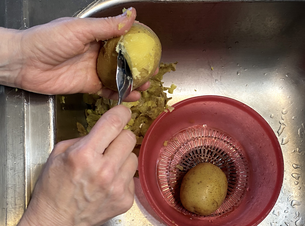 use grapefruit spoon to skin small boiled potatoes