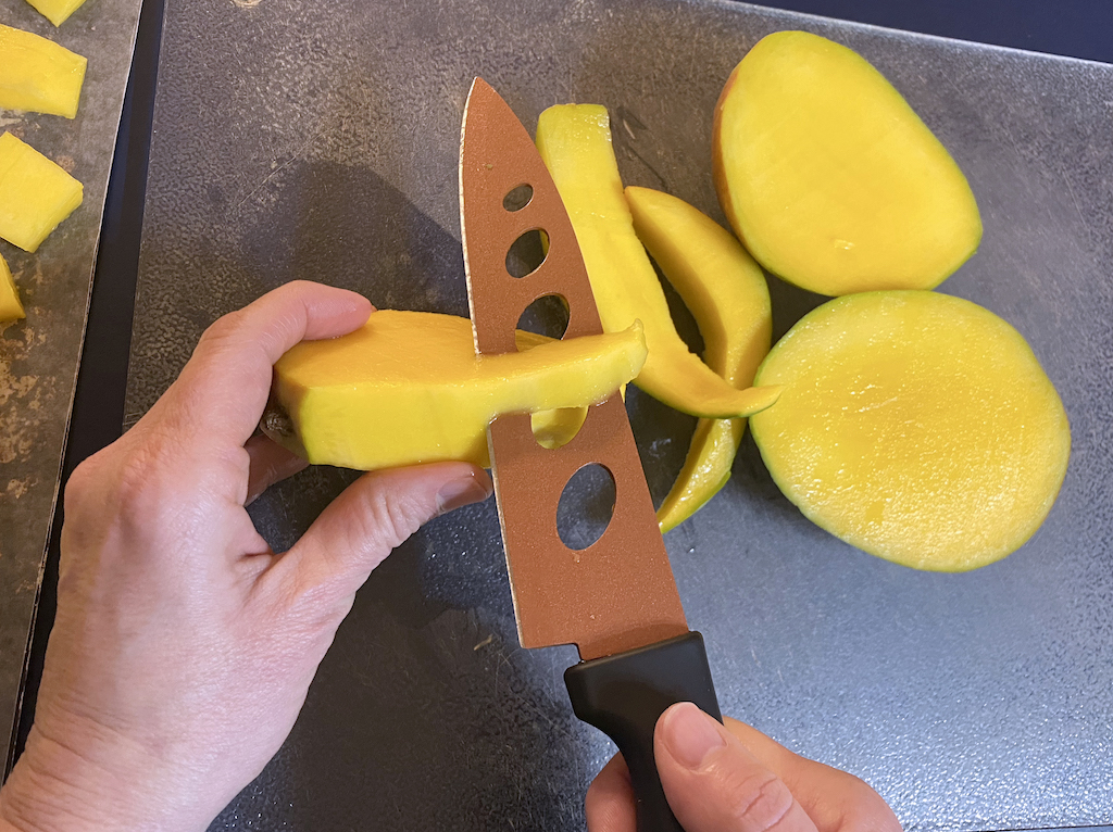 cutting around the mango pit