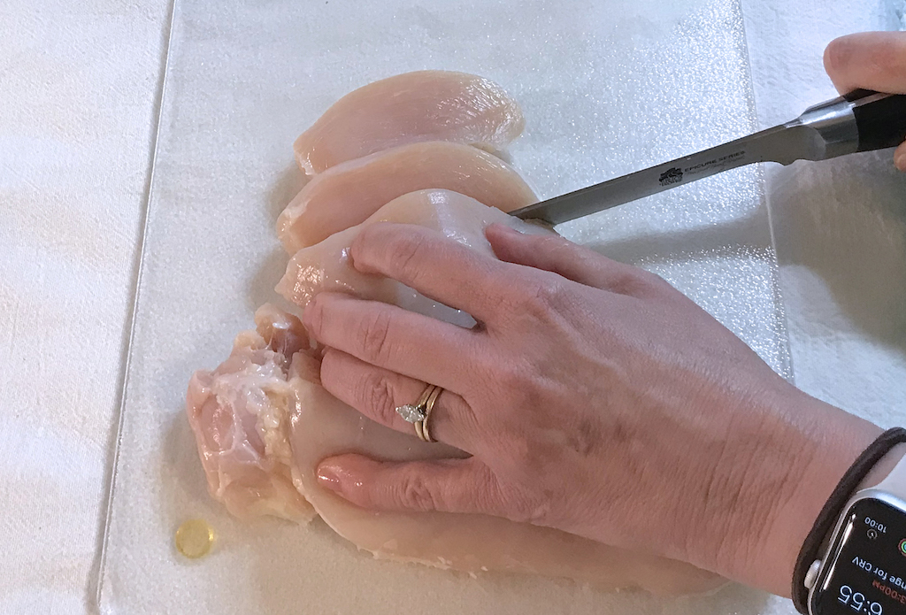 cutting against the grain of a chicken breast