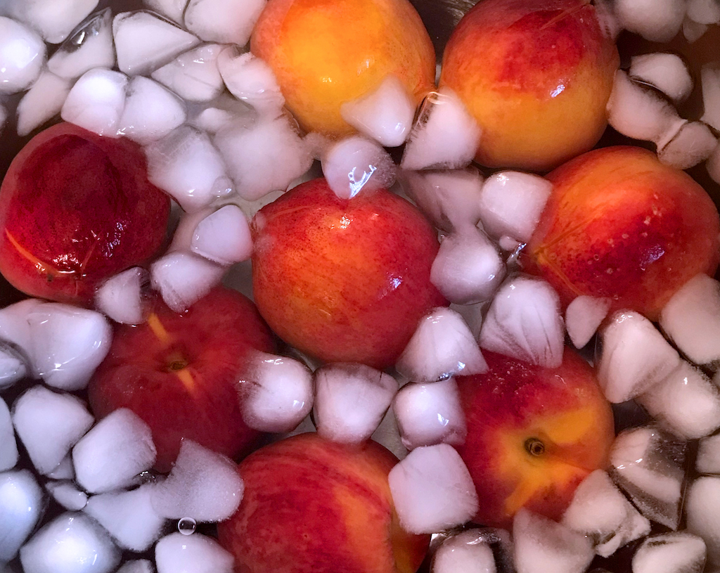 blanched peaches in ice bath