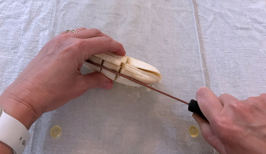 slicing banana on its back