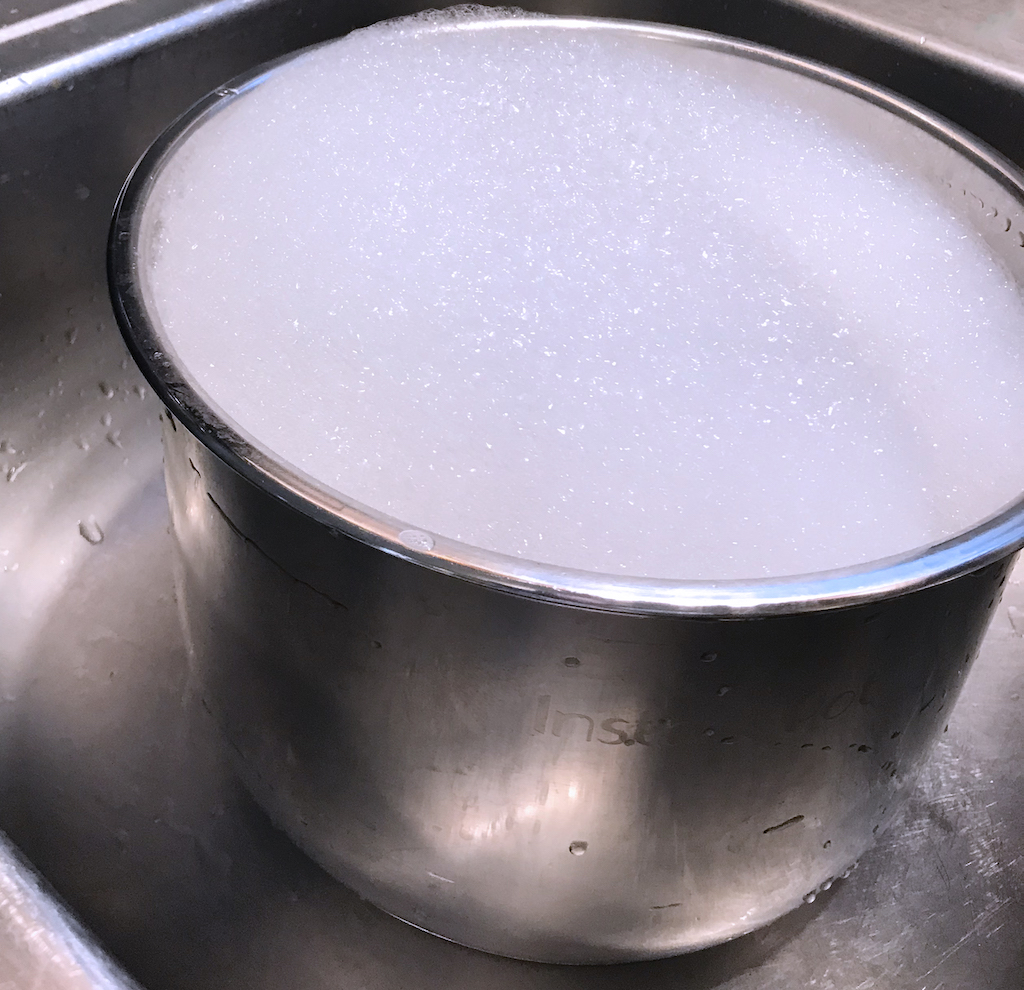 soaking a pan before cleaning up baked-on mess