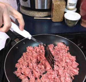chop ground beef into smaller chunks to brown