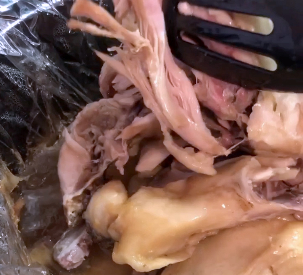 Meat cooked in the slow cooker falls off the bones