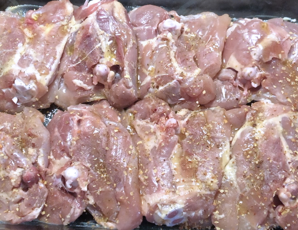 Bake chicken pieces with oil and spices on top