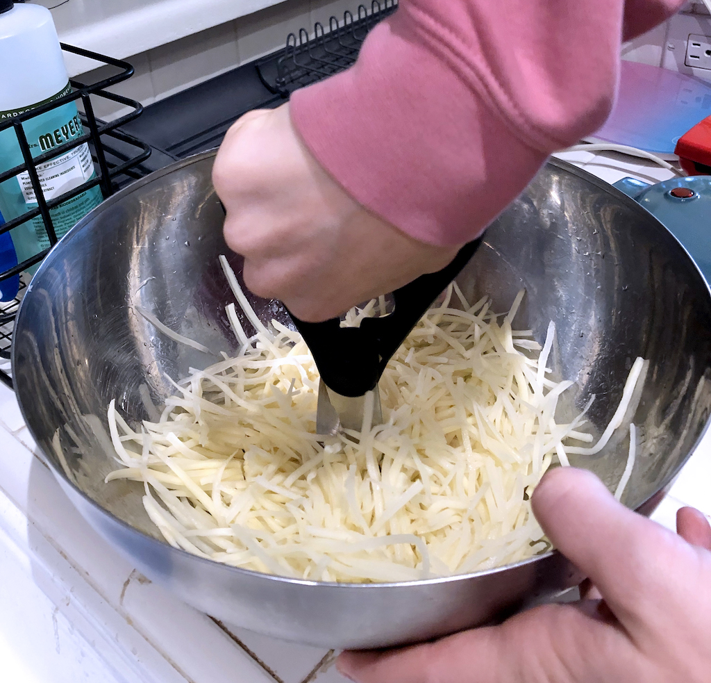 use kitchen shears to cut potato strands smaller